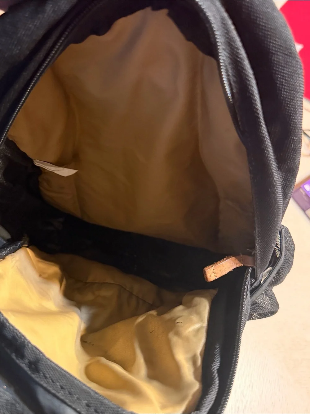 Timberland Black Sling Backpack with Brown Leather Accents